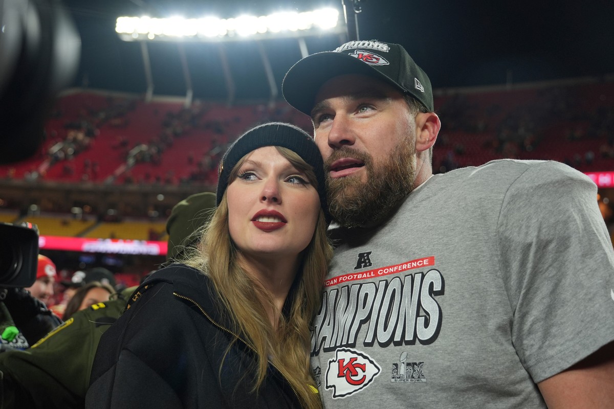 FILE - Kansas City Chiefs tight end Travis Kelce, right, is congratulated by Taylor Swift as they celebrate the Chiefs' victory over the Buffalo Bills in the AFC Championship NFL football game, J ...
