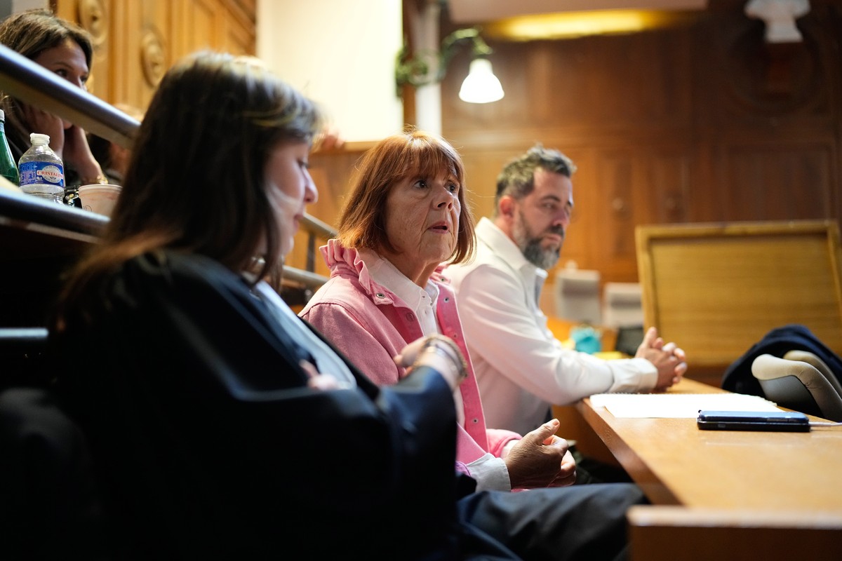 Gisele Pelicot, center, sits in the courtroom during the appeals trial in the case of a man challenging his conviction, less than a year after the landmark verdict in a drugging and rape trial that sh ...
