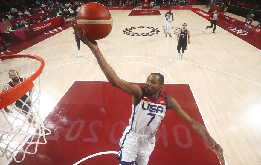United States&#039; Kevin Durant (7) drives to the basket during the men&#039;s basketball gold medal game against France at the 2020 Summer Olympics, Saturday, Aug. 7, 2021, in Saitama, Japan. (Grego ...