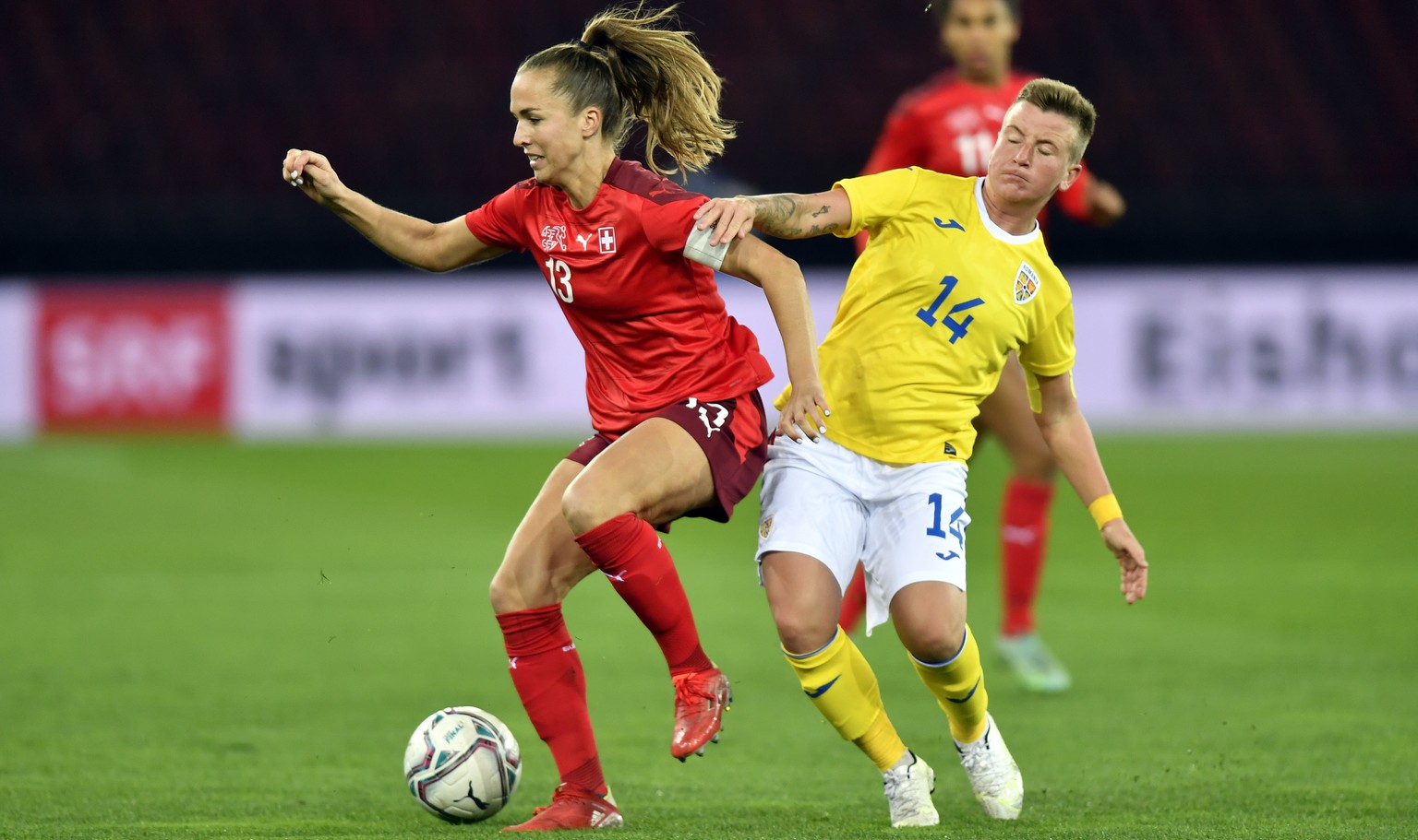 Swiss Lia Waelti in action against Romania&#039;s Andrea Herczeg, right, during the FIFA Women&#039;s World Cup 2023 qualifying round group G soccer match between Switzerland and Romania at the Stadio ...