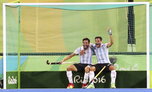 2016 Rio Olympics - Hockey - Final - Men's Gold Medal Match Belgium v Argentina - Olympic Hockey Centre - Rio de Janeiro, Brazil - 18/08/2016. Agustin Mazzilli (ARG) of Argentina (R) celebrates with Manuel Brunet (ARG) of Argentina after scoring his team's fourth goal. REUTERS/Vasily Fedosenko FOR EDITORIAL USE ONLY. NOT FOR SALE FOR MARKETING OR ADVERTISING CAMPAIGNS. 