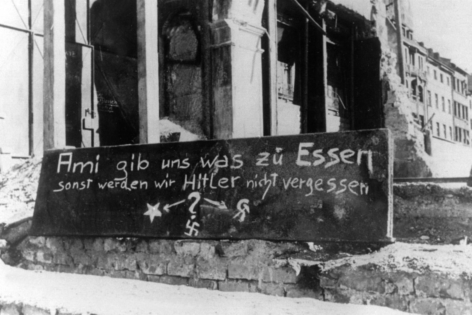 “Americans give us something to eat or we won’t forget Hitler” German graffiti during winter food shortages in Munich (1946)