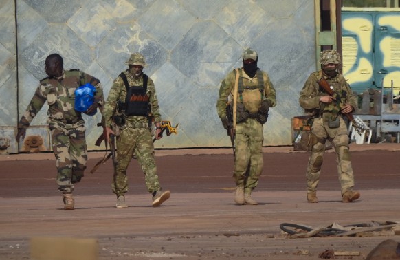 This undated photograph handed out by French military shows three Russian mercenaries, right, in northern Mali. Russia has engaged in under-the-radar military operations in at least half a dozen count ...