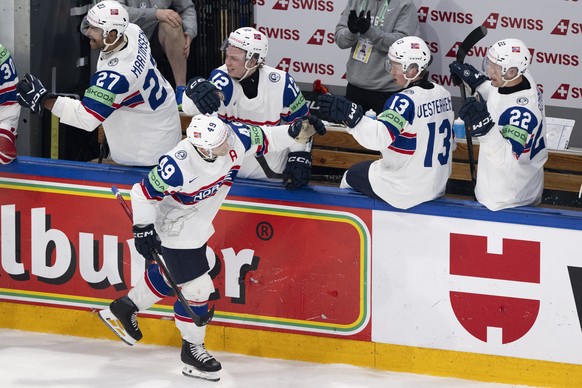 Norway's Christian Kaasastul celebrates his goal (3-0) with teammates during the 2026 IIHF Men's Ice Hockey World Championship preliminary round group B game between Italy and Norway, at the ...