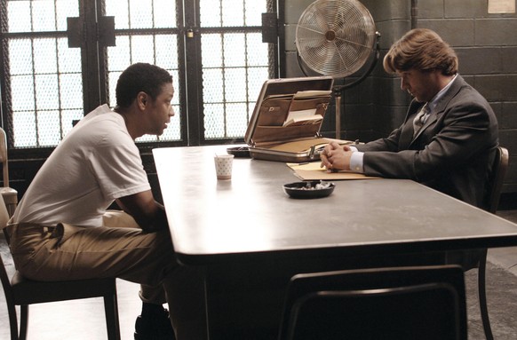 This undated photo released by Universal Studios shows actors Denzel Washington (left) as Gangster Frank Lucas and Russell Crow, as outcast cop Richie Roberts in a scene from "American Gangster.& ...
