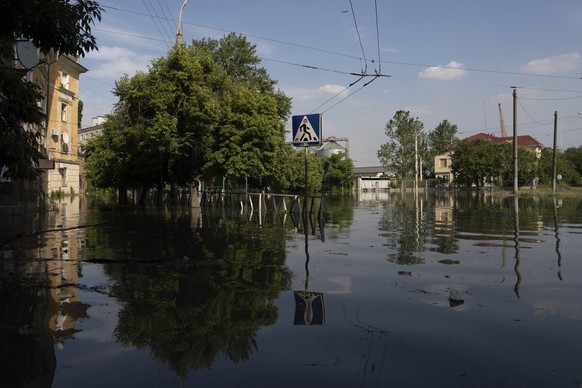 Streets are flooded in Kherson, Ukraine, Tuesday, Jun 6, 2023 after the Kakhovka dam was blown up overnight. The wall of a major dam in a part of southern Ukraine has collapsed, triggering floods, end ...
