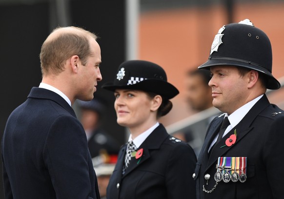 epa06306320 British Prince William, the Duke of Cambridge (L) talks to police members as he visits the Metropolitan Police Service Passing Out Parade in Hendon, London, Britain, 03 November 2017. The  ...