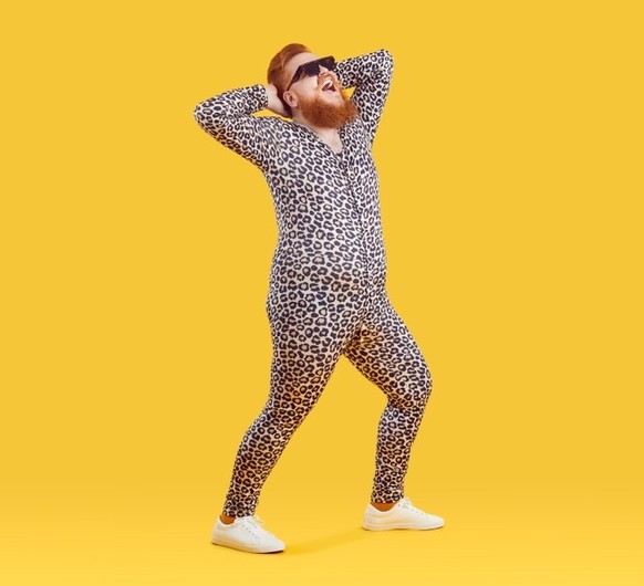 Bearded redhead guy in leopard print pajama onesie