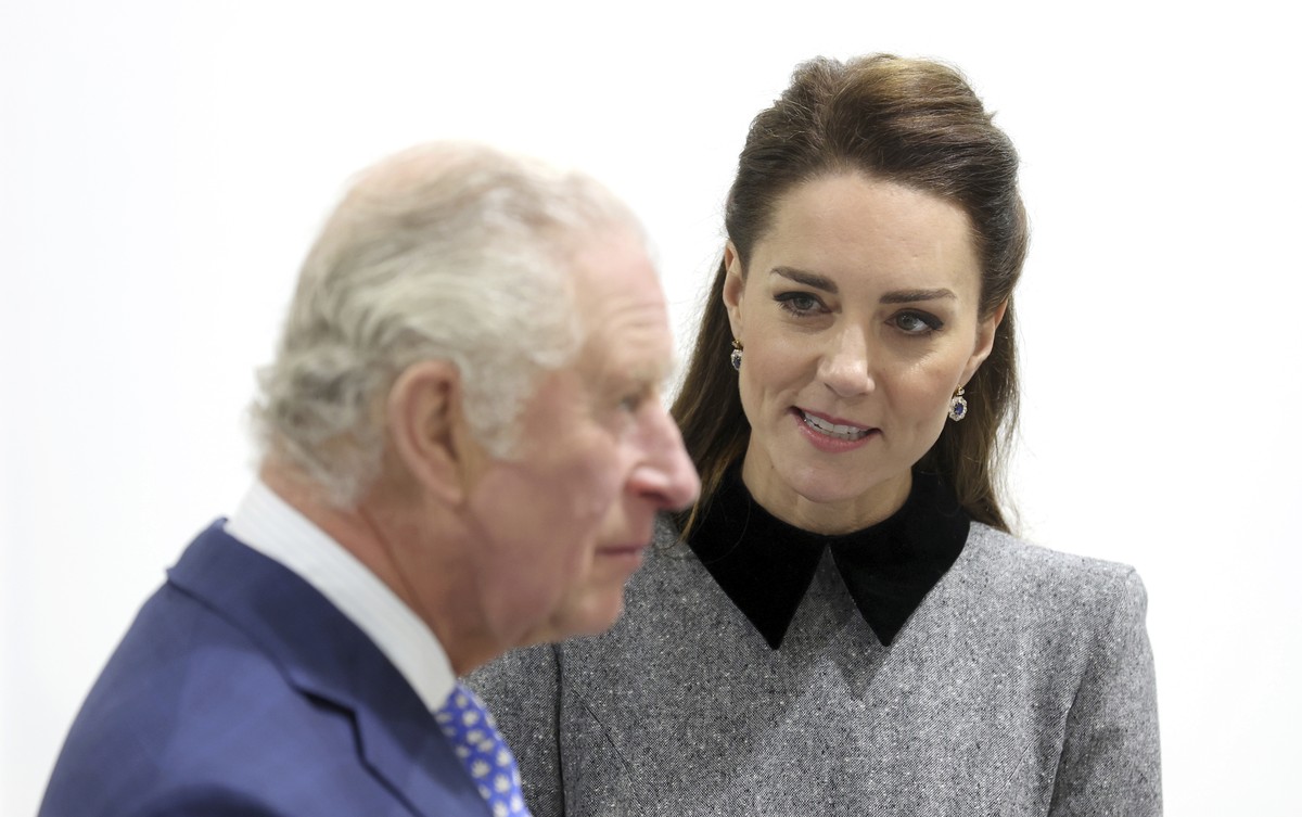 FILE - Britain's Prince Charles and Kate, Duchess of Cambridge during their visit to The Prince's Foundation training site for arts and culture at Trinity Buoy Wharf in London, England, Thur ...