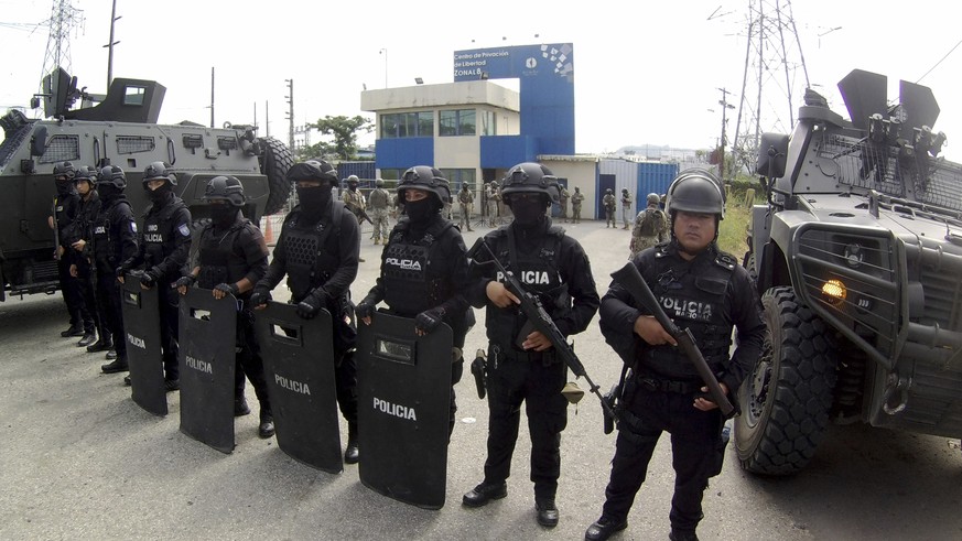 Police stand guard at the entrance of the penitentiary where former Vice President Jorge Glas is being held, in Guayaquil, Ecuador, Saturday, April 6, 2024. Ecuadorian police broke through the externa ...