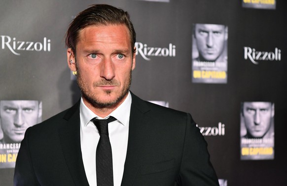 Roma soccer legend Francesco Totti poses for photographers during the presentation of his book &quot;Un Capitano&quot; (A Captain), in Rome, Thursday, Sept. 27, 2018. (Ettore Ferrari/ANSA via AP)