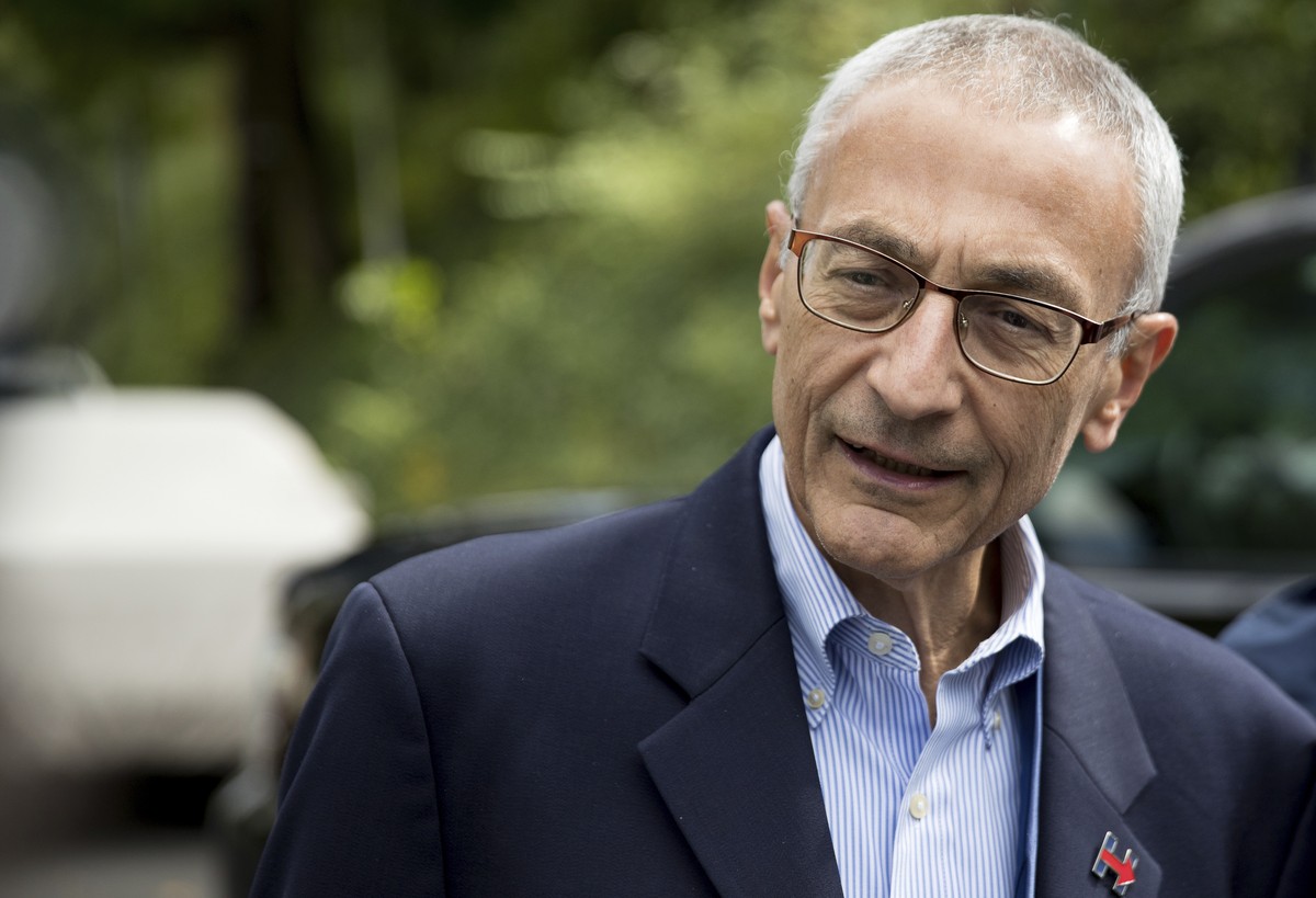 In this photo taken Oct. 5, 2016 file photo, Hillary Clinton's campaign manager John Podesta speaks to members of the media outside Democratic presidential candidate Hillary Clinton's home i ...
