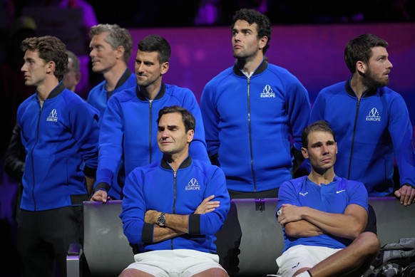 An emotional Roger Federer, left, of Team Europe sits alongside his playing partner Rafael Nadal after their Laver Cup doubles match against Team World's Jack Sock and Frances Tiafoe at the O2 arena i ...