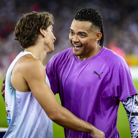 epa13195445 Armand Duplantis of Sweden, left, reacts with Emmanouil Karalis of Greece, right, in the Pole Vault Men final at the World Athletics Diamond League athletics meeting at the Letzigrund stad ...