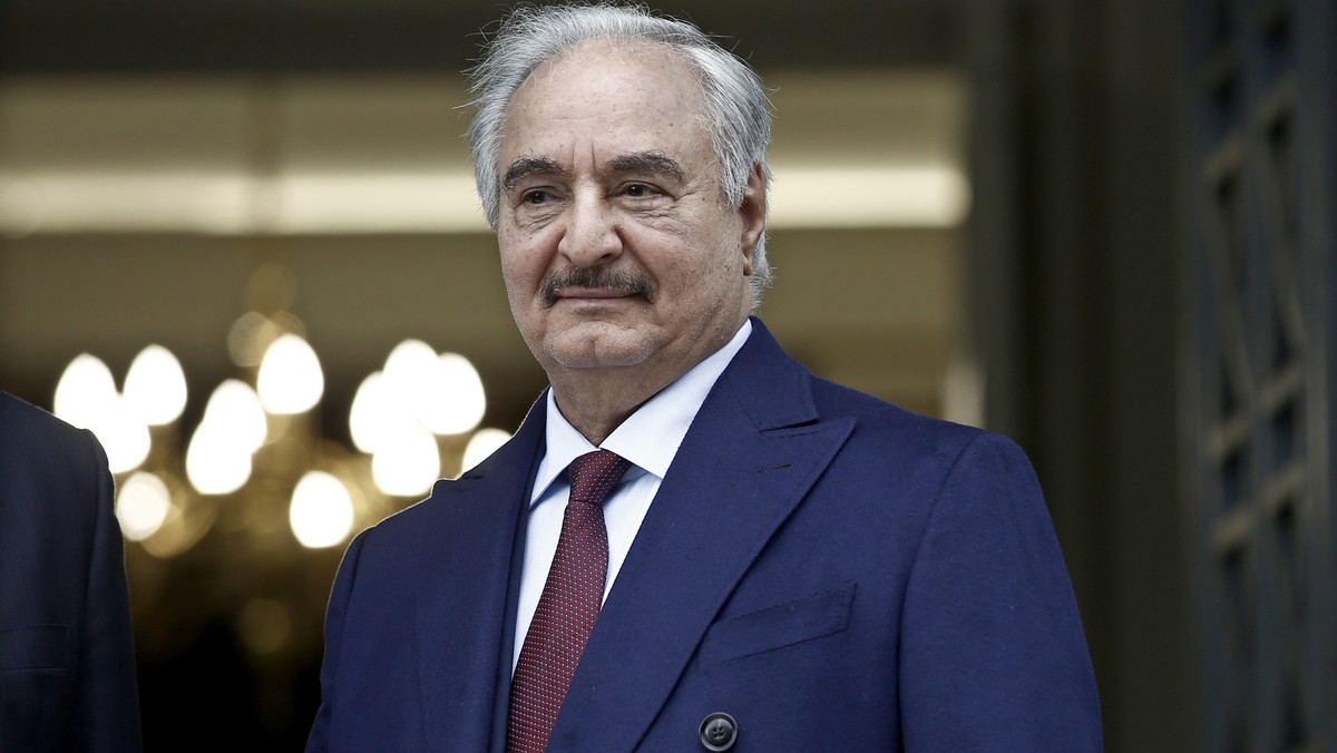 epa08135164 Commander of the Libyan National Army (LNA) Khalifa Haftar looks on as he is welcomed by Greek Foreign Ministrer Dendias during their meeting in Athens, Greece, 17 January 2020. Gen. Hafta ...