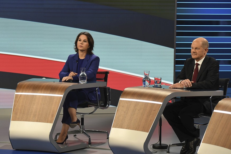 Candidates for the upcoming German election attend a final televised debate in Berlin, Thursday Sept. 23, 2021, ahead of the election on Sunday. Annalena Baerbock, Green Party co-leader, left, and Ola ...