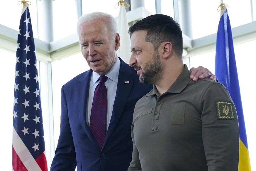 FILE - President Joe Biden, left, walks with Ukrainian President Volodymyr Zelenskyy ahead of a working session on Ukraine during the G7 Summit in Hiroshima, Japan, on May 21, 2023. A dash of pomp and ...