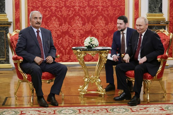 epa12089786 Russian President Vladimir Putin (R) meets with Libyan National Army Commander Khalifa Haftar (L) at the Kremlin in Moscow, Russia, 10 May 2025, during celebrations of the 80th anniversary ...