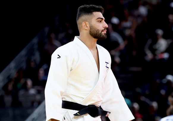 epa11504956 Tohar Butbul of Israel walks off the mat after his opponent Messaoud Redouane Dris of Algeria did not show and Butbul was declared winner by default in the Men -73kg Elimination Round of 3 ...