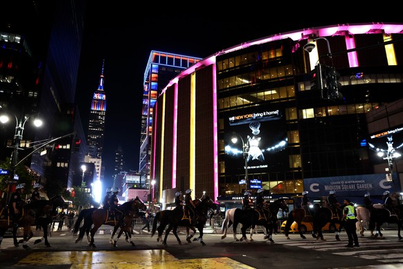 FILE - New York City police on horseback patrol the street by Madison Square Garden during Game 5 of the NBA Finals basketball series against the San Antonio Spurs, June 13, 2026, in New York. (AP Pho ...