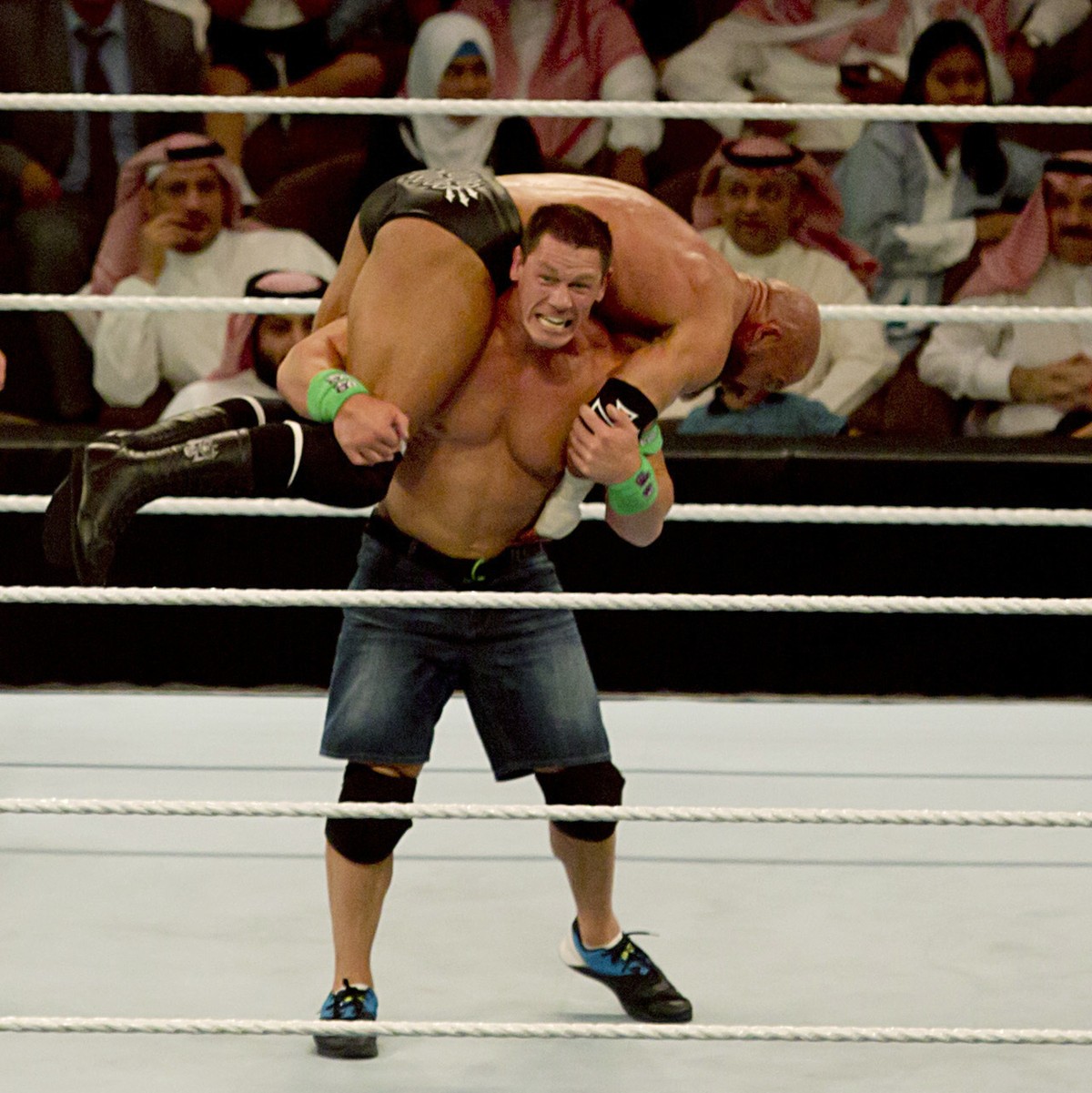 FILE - World Wrestling Entertainment star John Cena carries professional wrestler and WWE Executive Vice President Paul "Triple H" Levesque during their match of the "Greatest Royal Rum ...