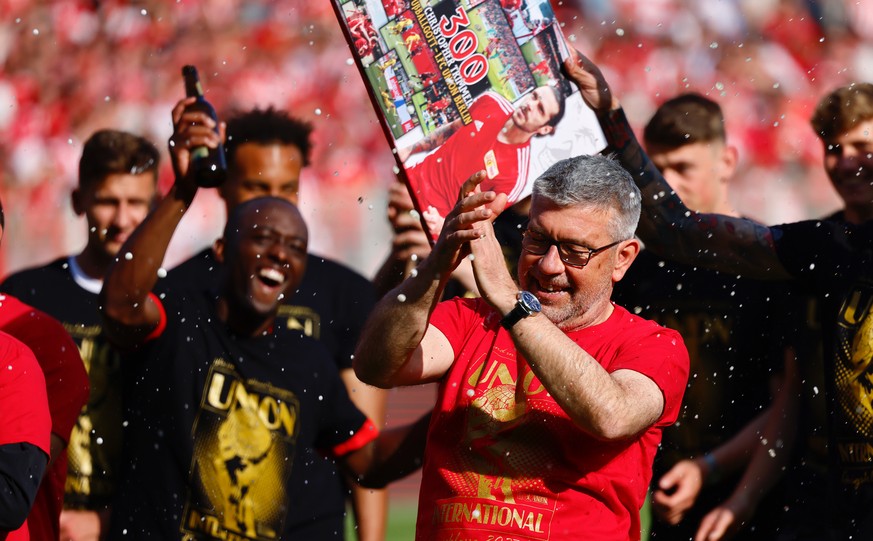 epa10657861 Union?s head coach Urs Fischer celebrates with his team after qualifying for the UEFA Champions League after the German Bundesliga soccer match between Union Berlin and SV Werder Bremen in ...