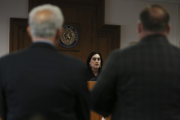 Judge Maya Guerra Gamble speaks to Alex Jones during his trial at the Travis County Courthouse in Austin, Texas, Tuesday, July 26, 2022. An attorney for the parents of one of the children who were kil ...