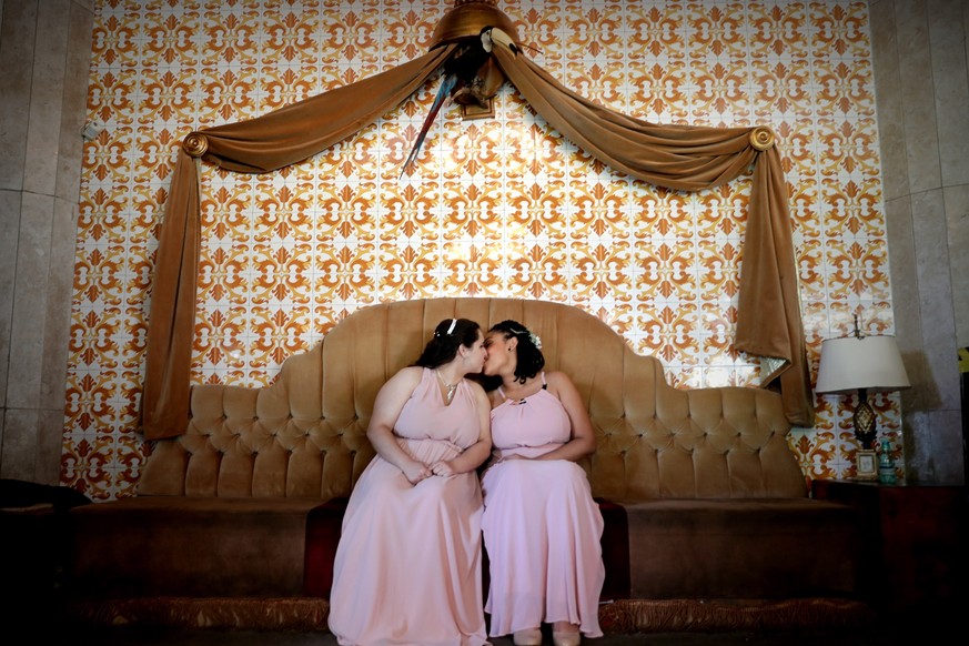 epa07248876 YEARENDER DECEMBER 2018

A lesbian couple kiss as they participate in a mass wedding in Sao Paulo, Brazil, 15 December 2018. Some 38 gay couples took part in the wedding ceremony as same ...