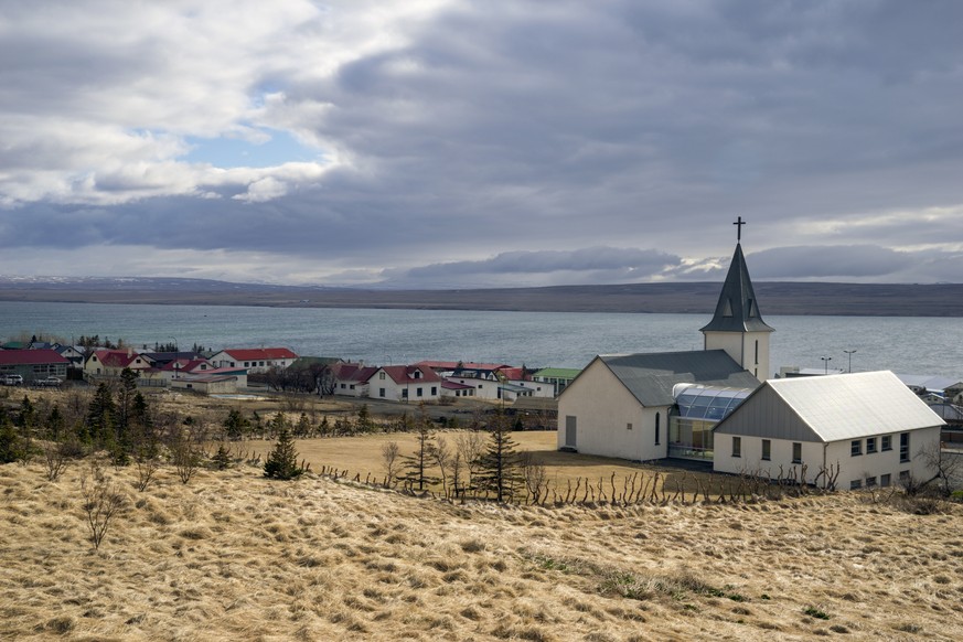 This photo taken on Thursday, April 30, 2020, shows a general view of the village of Hvammstangi in northern Iceland. High schools, dentists and hair salons are about to reopen in Iceland, which has m ...