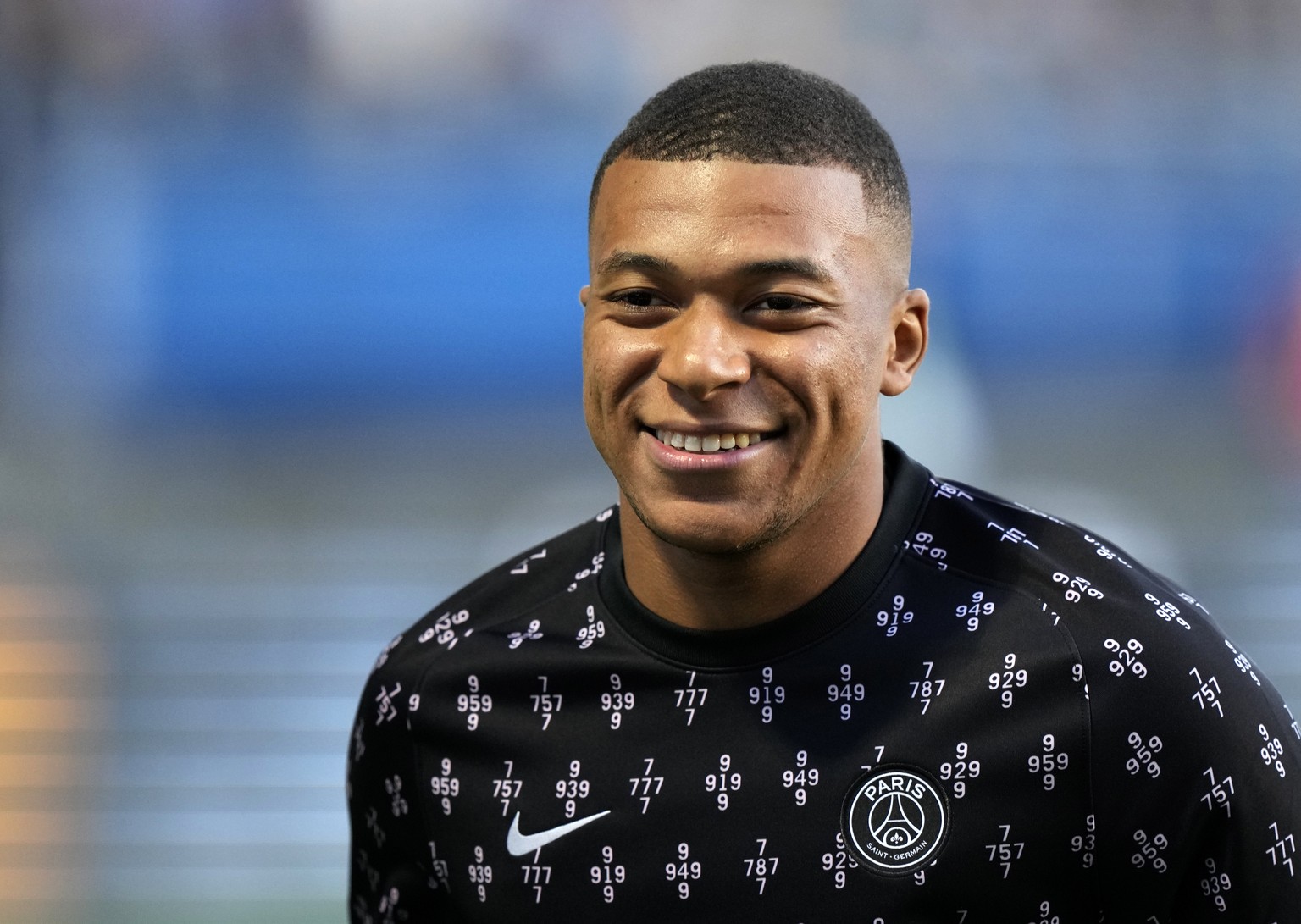 PSG&#039;s Kylian Mbappe smiles during the warm up before the French League One soccer match between Troyes and Paris Saint Germain, at the Stade de l&#039;Aube, in Troyes, France, Saturday, Aug. 7, 2 ...