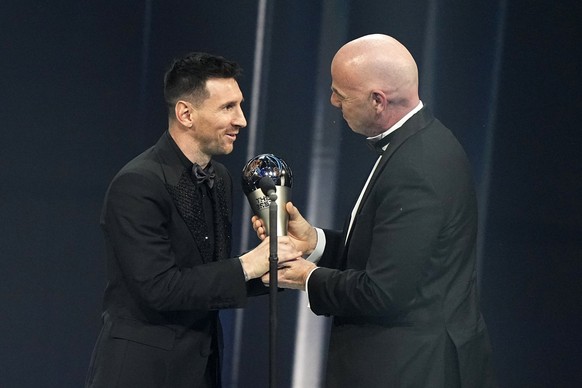 Argentina's Lionel Messi, left, receives the Best FIFA Men's player award from FIFA president Gianni Infantino during the ceremony of the Best FIFA Football Awards in Paris, France, Monday, ...