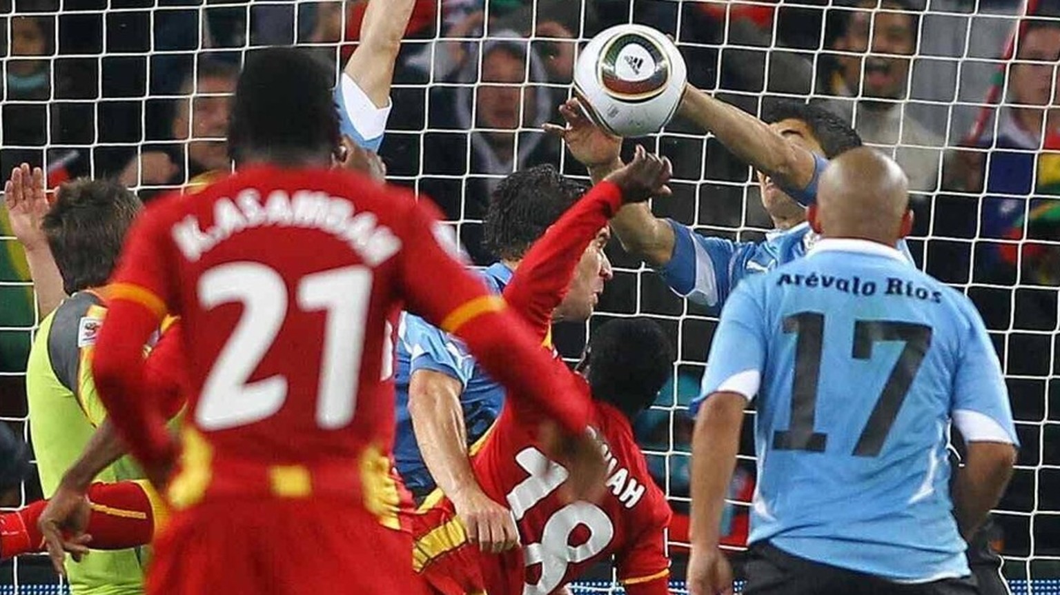 Mandatory Credit: Photo by Back Page Images/Shutterstock 1202890p Luis Suarez of Uruguay saving the ball with his hand for which he receives a red card and conceding a penalty against Ghana Uruguay v  ...