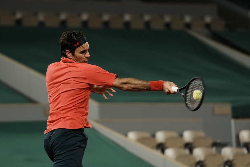 Switzerland&#039;s Roger Federer plays a return to Germany&#039;s Dominik Koepfer during their third round match on day 7, of the French Open tennis tournament at Roland Garros in Paris, France, Satur ...