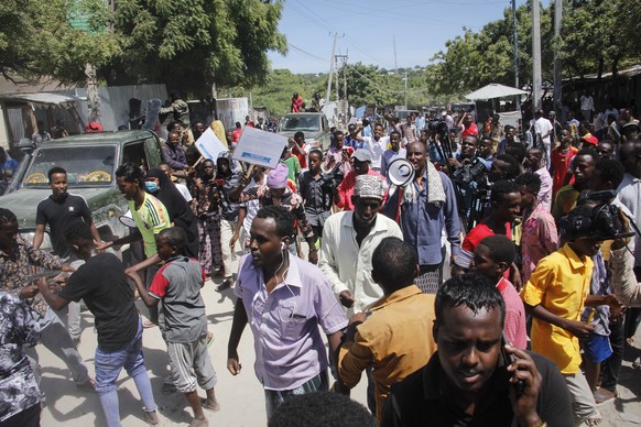 Demonstrators from Somali anti-government opposition groups protest in the Fagah area of Mogadishu, Somalia Sunday, April 25, 2021. Gunfire was exchanged Sunday between government forces loyal to Pres ...