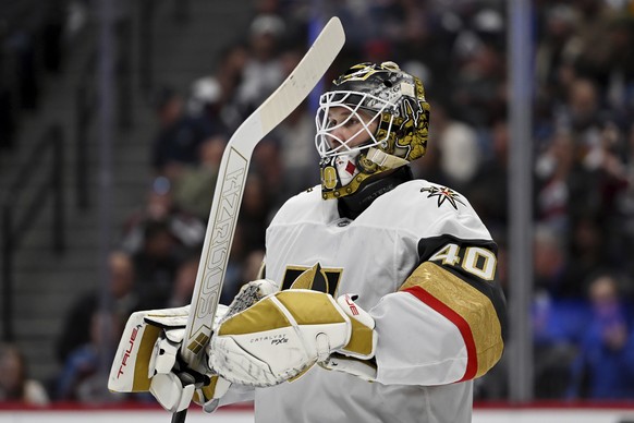 Vegas Golden Knights goaltender Akira Schmid (40) looks on during a pause in play in the first period of an NHL hockey game against the Colorado Avalanche Tuesday, April 8, 2025, in Denver. (AP Photo/ ...