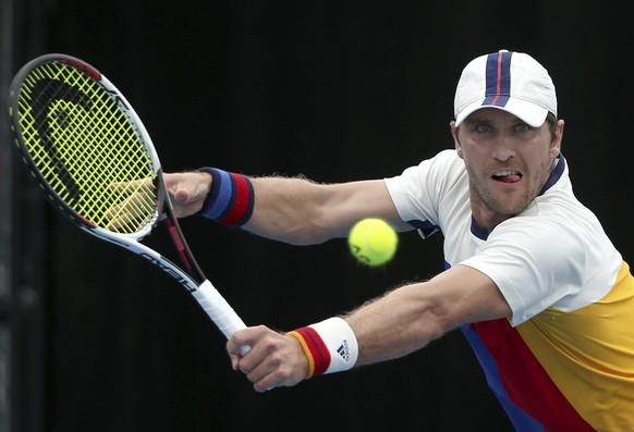 Germany&#039;s Mischa Zverev hits a backhand to Leonardo Mayer of Argentina during their match at the Sydney International tennis tournament in Sydney, Tuesday, Jan. 9, 2018. (AP Photo/Rick Rycroft)