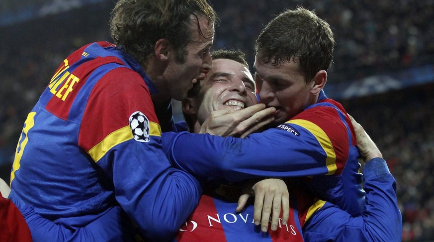 Basel&#039;s Alex Frei, center, celebrates after scoring the 2-0 with teammates Marco Streller, left, and Fabian Frei, right, during the UEFA Champions League Group C soccer match between Switzerland& ...