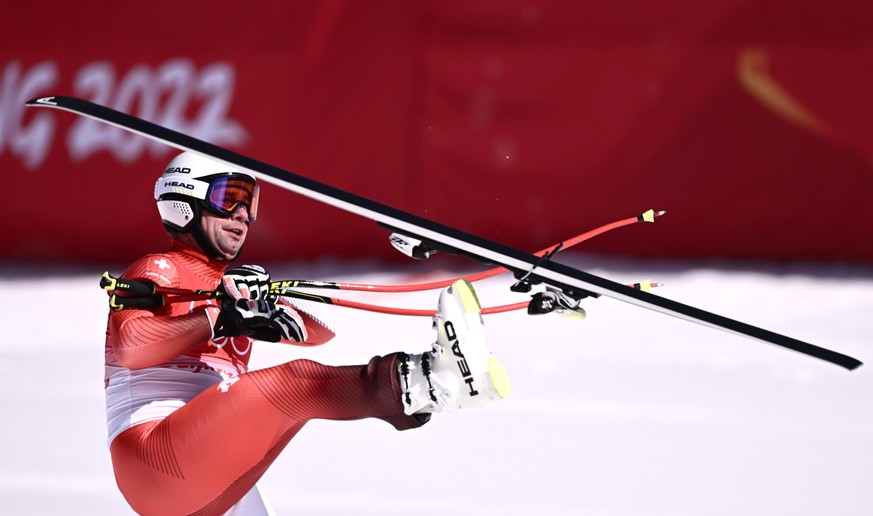 epa09734556 Beat Feuz of Switzerland reacts in the finish area during the Men&#039;s Downhill race of the Alpine Skiing events of the Beijing 2022 Olympic Games at the Yanqing National Alpine Ski Cent ...