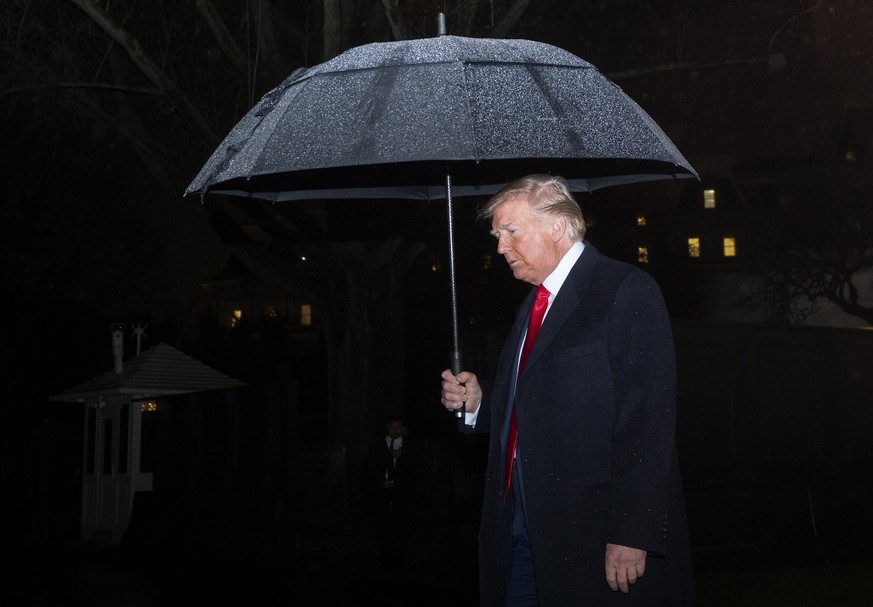 epa08061324 US President Donald J. Trump walks to Marine One on the South Lawn of the White House in Washington, DC, USA, 10 December 2019, as he departs for a Keep America Great Rally in Hershey, Pen ...