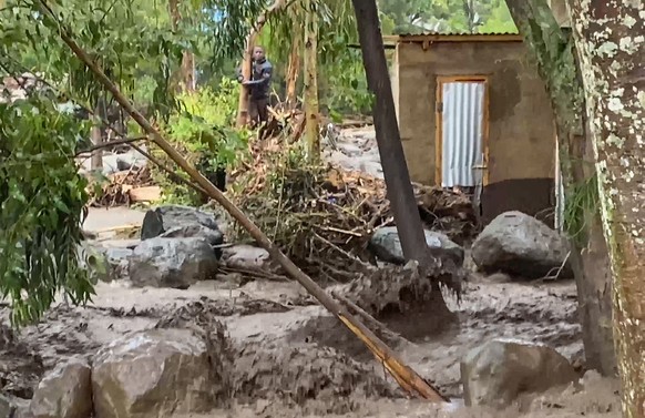 In this frame grab from video, flooded streets are seen in the town of Katesh, in Tanzania, Sunday, Dec 3, 2023. The town of Katesh was hit with heavy rain on Saturday, and roads were blocked by mud a ...