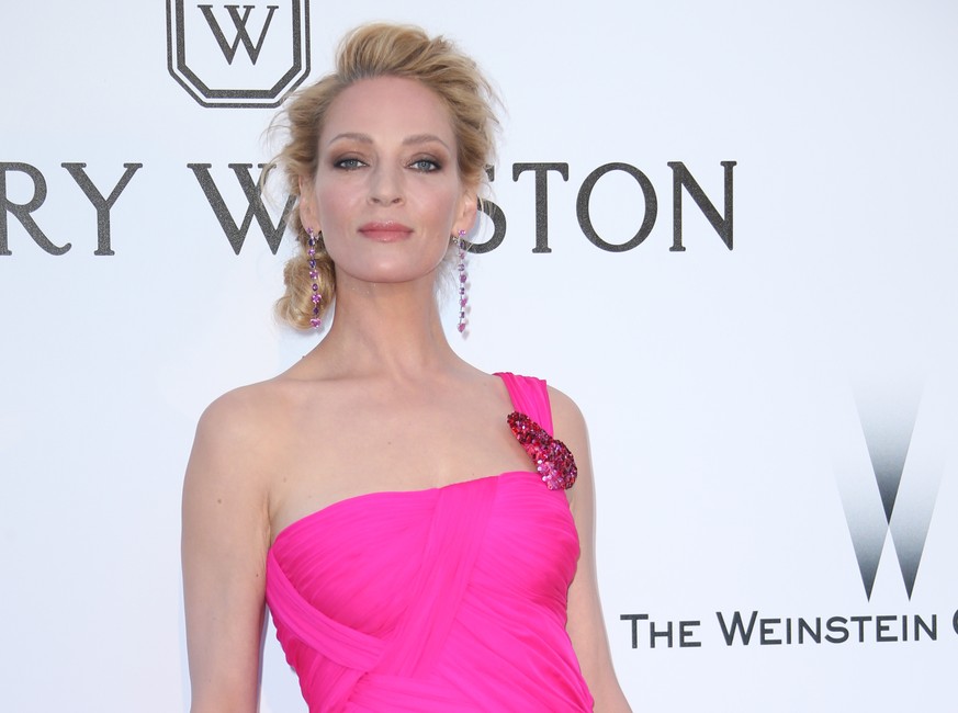 FILE - In this May 19, 2016, file photo, actress Uma Thurman poses for photographers upon arrival at the amfAR Cinema Against AIDS benefit at the Hotel du Cap-Eden-Roc, during the 69th Cannes Internat ...