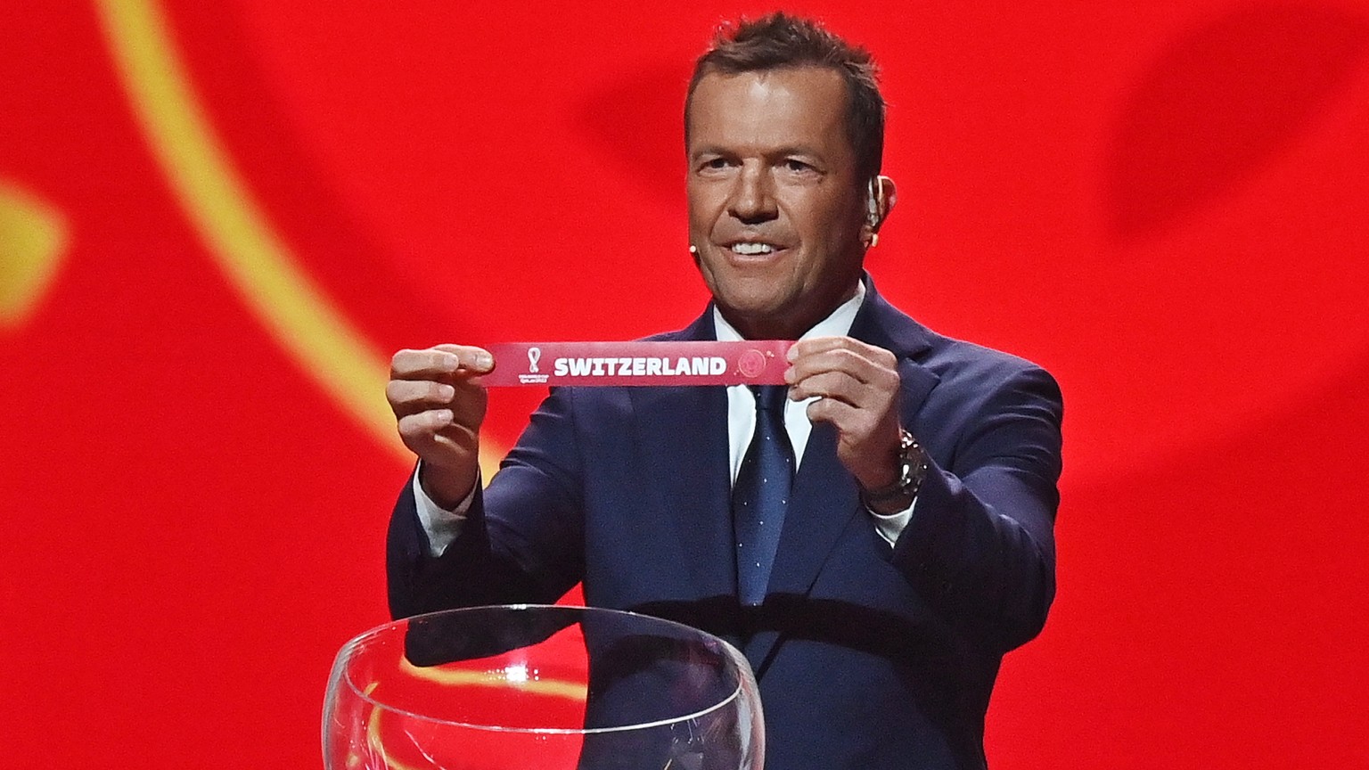 epa09864131 Former German international Lothar Matthaeus with the ticket of Switzerland during the main draw for the FIFA World Cup 2022 in Doha, Qatar, 01 April 2022. EPA/NOUSHAD THEKKAYIL