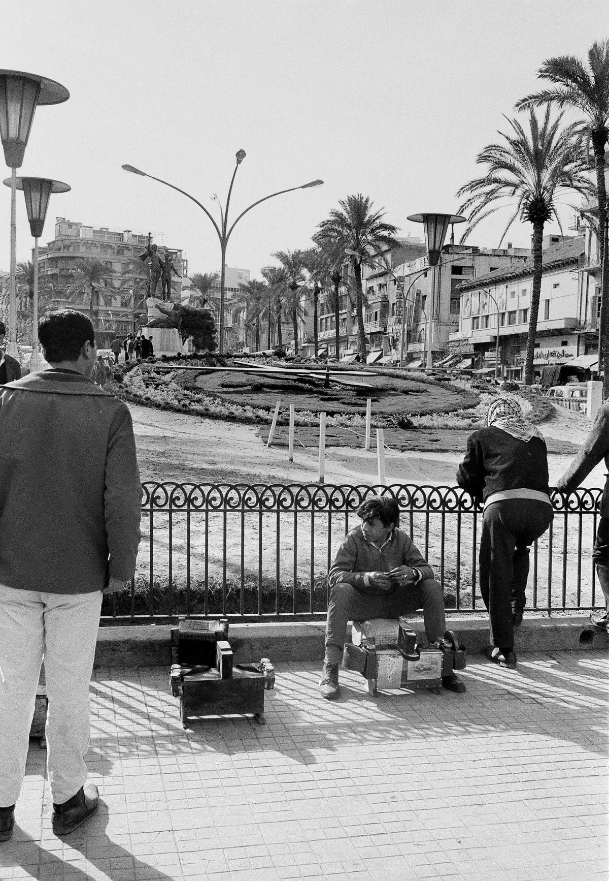 A shoe-shine boy and and others resting in Martyrs' Square in the Old Beirut section of Lebanon, Feb. 1969. (AP Photo)