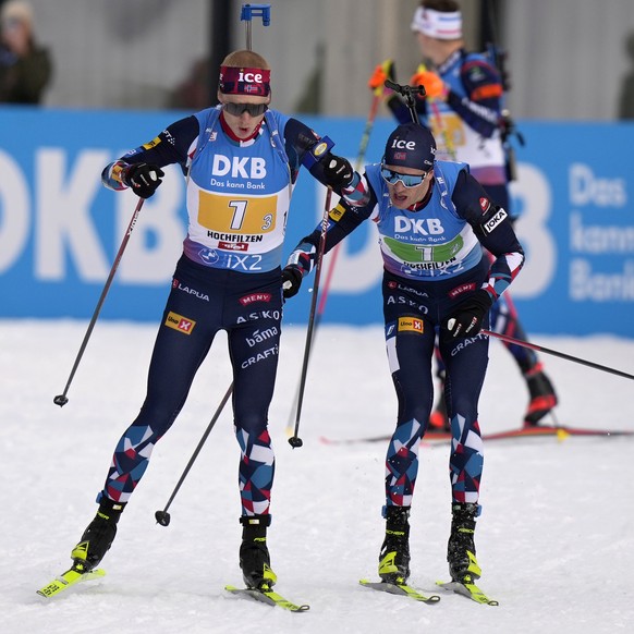 Tarjei Boe of Norway tags teammate Johannes Thingnes Boe, left, during the men&#039;s 4 X 7.5 km relay competition at the Biathlon World Cup in Hochfilzen, Austria, Sunday, Dec. 10, 2023. (AP Photo/Ma ...