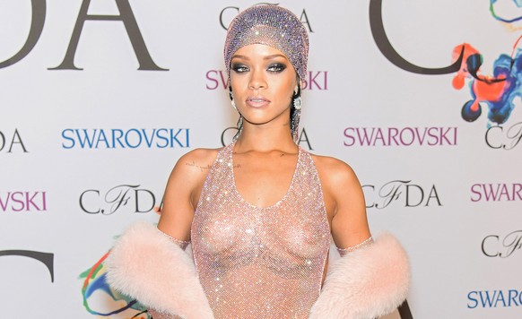 NEW YORK, NY - JUNE 02: (EDITORS NOTE: Image contains partial nudity.) Recipient of the 2014 CFDA Fashion Icon Award, Rihanna attends the 2014 CFDA fashion awards at Alice Tully Hall, Lincoln Center o ...