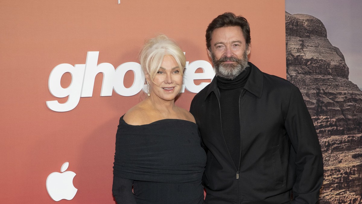 epa10579496 Deborra-Lee Furness (L) and Actor Hugh Jackman (R) pose on the red carpet during the premiere of Apple Original Films 'Ghosted' at the AMC Lincoln Square in New York, New York, U ...
