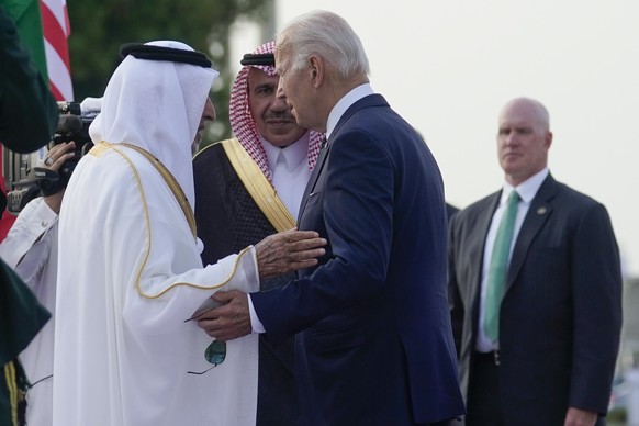 President Joe Biden is greeted by officials as he arrives at King Abdulaziz International Airport, Friday, July 15, 2022, in Jeddah, Saudi Arabia. (AP Photo/Evan Vucci)
Joe Biden