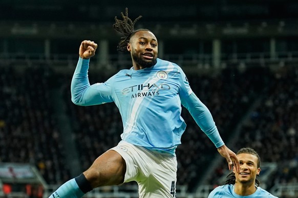 Manchester City's Antoine Semenyo, left, celebrates a goal that was later disallowed by a VAR decision during the English League Cup semifinal first leg soccer match between Newcastle and Manches ...
