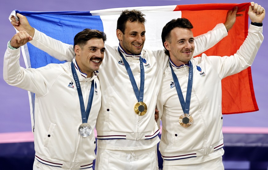 epa11520668 (L-R) Second placed silver medal winner Sylvain Andre of France, gold medal winner Joris Daudet of France and third placed bronze medal winner Romain Mahieu of France celebrate on the podi ...