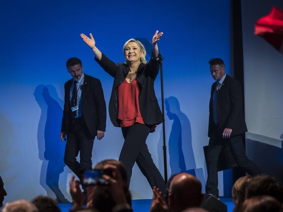 epa05916036 Marine Le Pen, French National Front (FN) political party leader and candidate for French 2017 presidential election, arrives on stage to deliver a speech during an election campaign rally ...